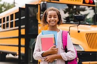 smiling-african-american-schoolgirl-going-back-to-2022-01-18-23-35-09-utc-copy-1.jpg